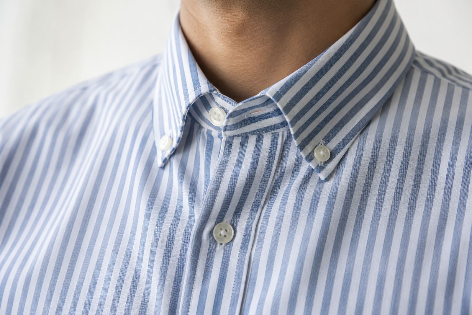 A blue striped button-down shirt