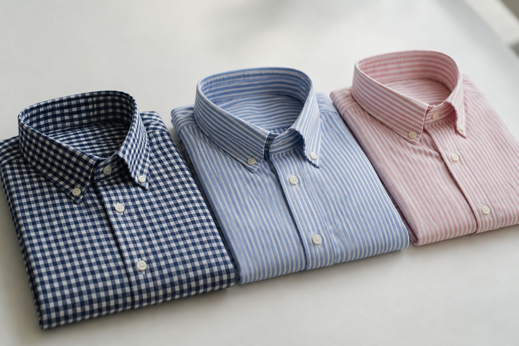 Folded gingham and striped shirts
